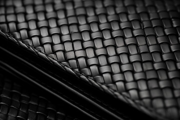 Close-up shot of a black leather wallet mock-up, showcasing intricate texture and craftsmanship