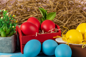 Fototapeta na wymiar eggs in wooden box with hay on rustic background or surface, easter or holiday concept