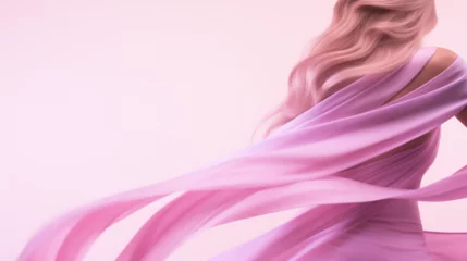 Deurstickers Jeune femme portant une robe rose volant au vent au premier plan. Fond beige, rose. Élégance, beauté, féminin. Fond pour conception et création graphique. © FlyStun