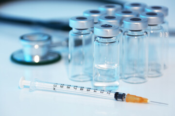 Medical syringe stethoscope and vaccine ampule bottles