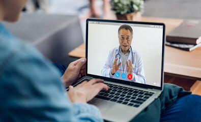 Woman talk speak using laptop computer and video conference online with doctor and stethoscope...