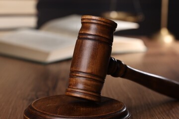 Law concept. Judge's gavel on wooden table, closeup