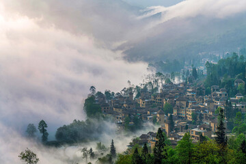 The cottage in the morning fog of Ailao Mountain, Yuanyang County, Honghe Prefecture, Yunnan Province, China.