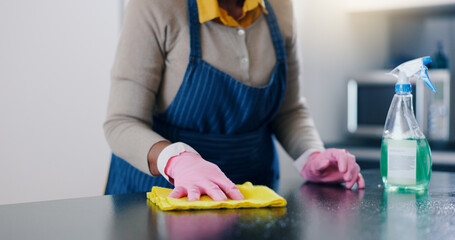 Woman, hands and cleaning table in kitchen for housekeeping, hygiene or sanitary surface at home....