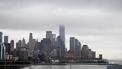 city skyscrapers in the fog