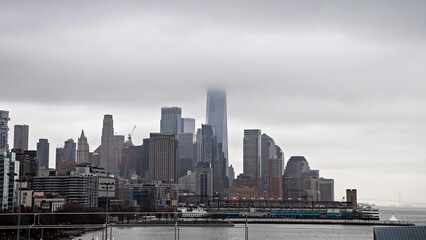 Naklejka premium city skyscrapers in the fog