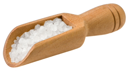 grain salt in the wooden scoop, isolated on white background.