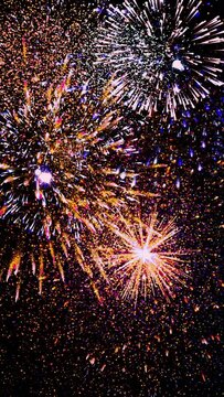 fireworks in the night sky. Vertical design in 9:16 ratio for smartphone and social media