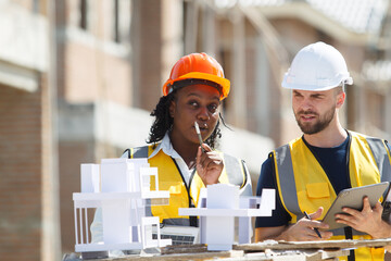 Professional - senior civil engineers inspecting or working in construction site.