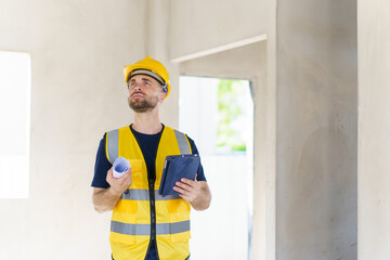 Senior professional caucasian white male real estate foreman inspecting inside the building construction, foreman checking the under construction building. Caucasian male engineer inspects interior.