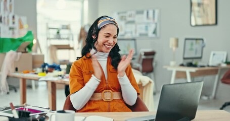 Laptop, success and applause with a fashion designer woman at her desk in celebration of a target. Computer, winner and a happy young creative employee clapping in the office for a deal or goal