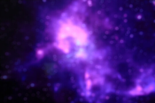 Blurry image of abstract bright galaxy on black background