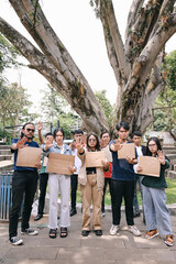 Serious group of activist holding blank cardboard and making stop gesture