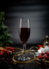 Red beverage in dark chirstmas theme