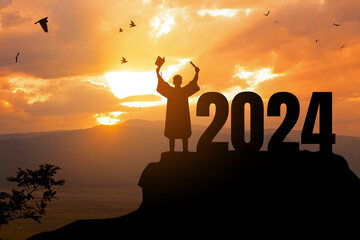 2024 New Year resolution.Silhouette Young man Graduation in 2024 years, education congratulation...