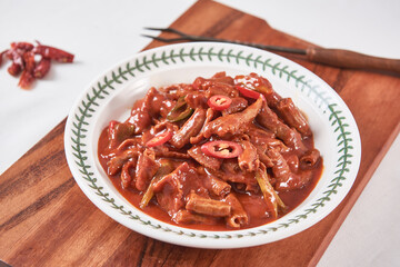Spicy and delicious seasoned pork tripe on a plate