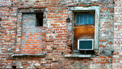Windows are bricked up in old building, redevelopment of old houses