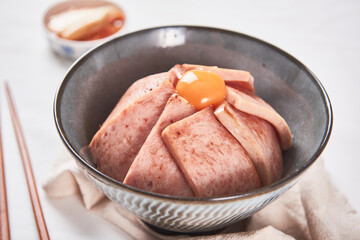 a bowl of deliciously cooked ham and egg yolk