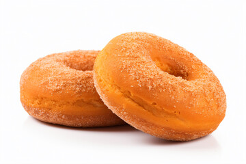 two sugar covered donuts on a white surface