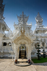 Ornate white temples with there intricate carvings and sculptures normally created by Buddhist monks