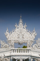 Ornate white temples with there intricate carvings and sculptures normally created by Buddhist monks