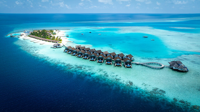 The Tropical aerial view with maldives paradise scenery seascape with water villas as amazing sea and lagoon beach, Exotic tourism