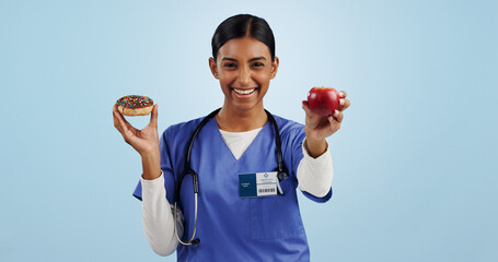 Apple, donut and portrait of nurse with choice for healthy eating, diet and detox on blue...