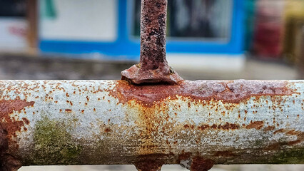 Corrosion on iron fence. Rusty metal fence. Steel pipes rust. The old metal structure got rust on surface and almost damage. Iron fence beginning to corrode. Old rusty fence.