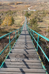 Obraz premium a very long road to the top of the mountain of the Bayanaul Nature Reserve in autumn