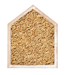 Rice is piled in wooden boxes shaped like houses. Grain reserves.