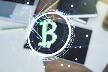 Creative Bitcoin concept and modern digital tablet on desktop on background, top view. Double exposure