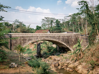 Fototapeta premium An ancient Dutch-made bridge in a residential area in the village
