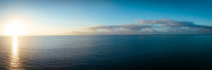 Fototapeta premium Panoramaic view of beautiful sea wave and sunrise sky