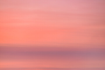 Obraz premium A beautiful sky tinted by the sun leaving vibrant shades of gold, pink, blue and multicolored. Clouds in the twilight evening and morning sky. Image of a cloudy sky in the evening and during the day