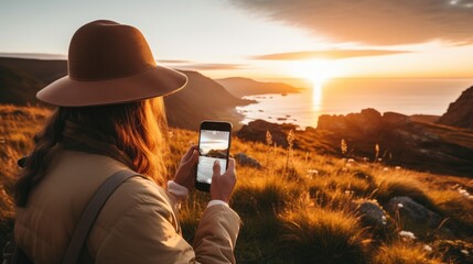 Travel blogger is taking photos with a smartphone - obrazy, fototapety, plakaty