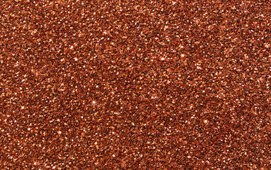 Golden red brown glitter bokeh sparkling light shining background. Christmas, New Year, Valentine, Anniversary and Celebration backgrounds concepts. 