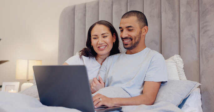 Laptop, Smile And Young Couple In Bed Watching Movie, Film Or Show Together At Home. Happy, Technology And Man And Woman Relaxing In Bedroom Streaming A Video On Computer For Bonding At Modern House.