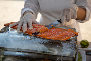 caterer cook slices smoked fish salmon trout