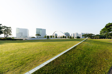 green lawn with city skyline in guangzhou china