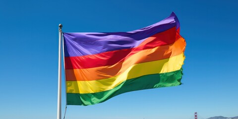 LGBT flag, full of colorful rainbows, billows in the breeze as it's waved by a hand adorned with a sweatband.