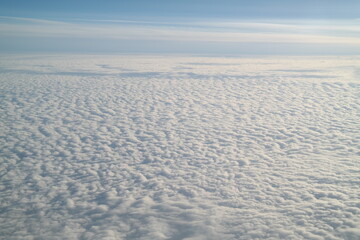 Fototapeta na wymiar Wide white clouds seen from above