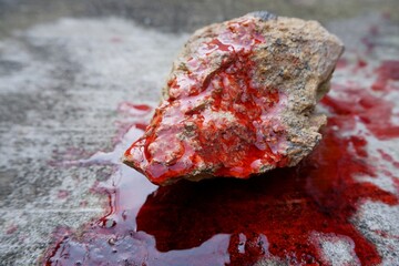 blood spills on the floor. concept photo for illustration of suicide and rock mountain to kill