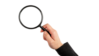 Hand holding a magnifying glass - isolated on transparent background