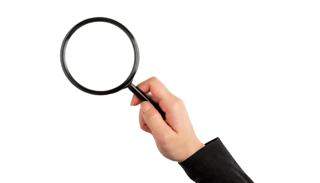 Hand holding a magnifying glass - isolated on transparent background