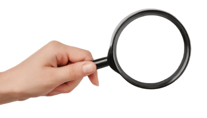 Hand holding a magnifying glass - isolated on transparent background