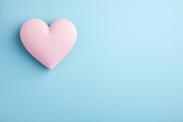 Pink heart on blue background. Valentines day concept with copy space
