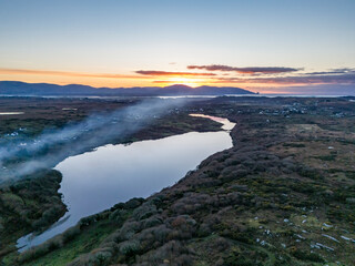 Smoke over Lough Fad due to traditionally burning of waste in rural Ireland - County Donegal