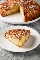 Authentic Norwegian apple cake Eplekake delicious dessert that perfect for autumn on a plate close-up on the table. Vertical