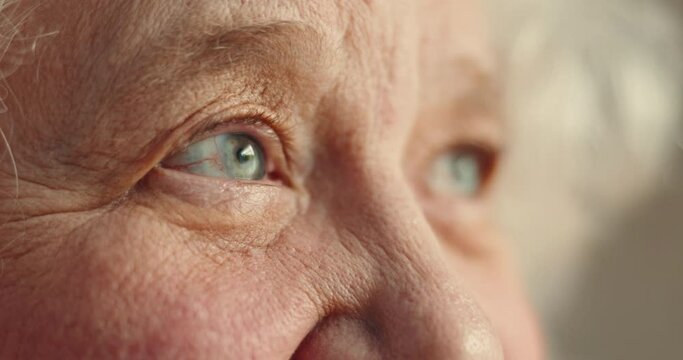 Eyes, thinking and senior woman closeup in a nursing home with memory, nostalgia or moment of reflection closeup. Remember, face and zoom on elderly female person waiting in a retirement facility