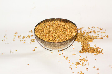 bowl of Dried Coriander on white background